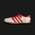 Adidas Tokyo MJ shoes in Cream White, Red, and Gold Metallic (IH3999). Features a premium cream white leather upper with vibrant red Three Stripes and metallic gold "Tokyo" branding. Sleek, retro-minimalist low-profile design with a thin rubber outsole. Luxuntique offers 100% authentic Adidas in Sri Lanka.