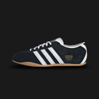 Adidas Tokyo shoes in Core Black, Cloud White, and Gum (JI0183). Features a premium black leather upper with crisp white Three Stripes and metallic gold Tokyo branding. Finished with a classic low-profile gum rubber outsole and a slim, retro-minimalist silhouette. Luxuntique offers 100% authentic Adidas in Sri Lanka.