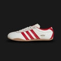 Adidas Tokyo shoes in Off White, Better Scarlet, and Gum (JI3300). Features a premium Off White leather upper with vibrant Better Scarlet red Three Stripes and metallic gold "Tokyo" branding. Finished with a classic low-profile gum rubber outsole and a slim, retro-minimalist silhouette. Luxuntique offers 100% authentic Adidas in Sri Lanka.