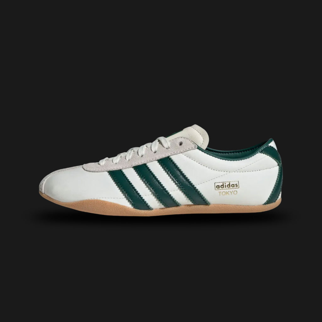 Adidas Tokyo shoes in Off White, Collegiate Green, and Gold Metallic (JP9705). Features a premium smooth Off White leather upper with vibrant Collegiate Green Three Stripes and iconic gold foil "Tokyo" branding. Sleek, retro-minimalist low-profile design with a thin gum sole. Luxuntique offers 100% authentic Adidas in Sri Lanka.
