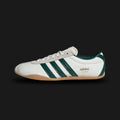 Adidas Tokyo shoes in Off White, Collegiate Green, and Gold Metallic (JP9705). Features a premium smooth Off White leather upper with vibrant Collegiate Green Three Stripes and iconic gold foil "Tokyo" branding. Sleek, retro-minimalist low-profile design with a thin gum sole. Luxuntique offers 100% authentic Adidas in Sri Lanka.