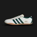 Adidas Tokyo shoes in Off White, Collegiate Green, and Gold Metallic (JP9705). Features a premium smooth Off White leather upper with vibrant Collegiate Green Three Stripes and iconic gold foil "Tokyo" branding. Sleek, retro-minimalist low-profile design with a thin gum sole. Luxuntique offers 100% authentic Adidas in Sri Lanka.