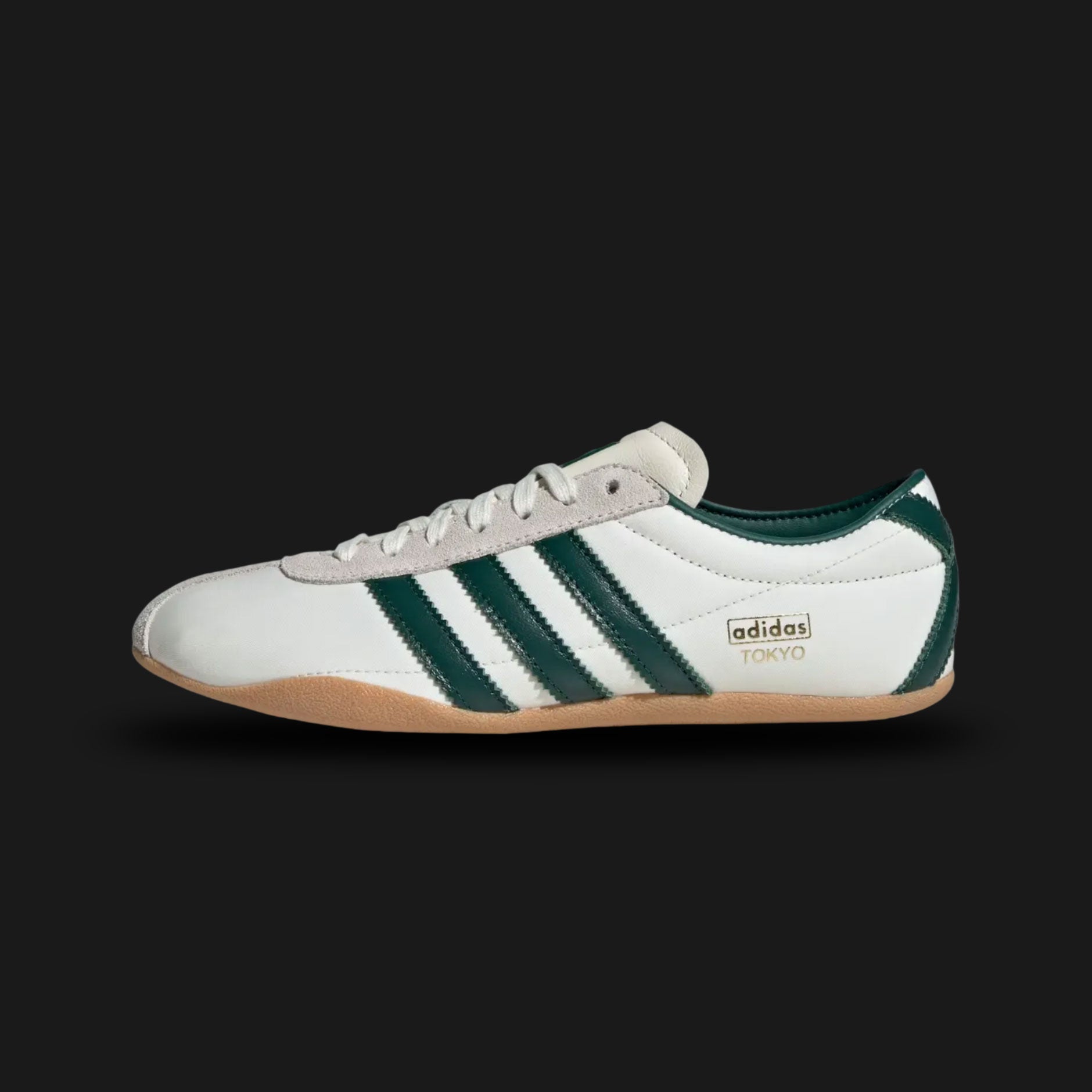 Adidas Tokyo shoes in Off White, Collegiate Green, and Gold Metallic (JP9705). Features a premium smooth Off White leather upper with vibrant Collegiate Green Three Stripes and iconic gold foil "Tokyo" branding. Sleek, retro-minimalist low-profile design with a thin gum sole. Luxuntique offers 100% authentic Adidas in Sri Lanka.