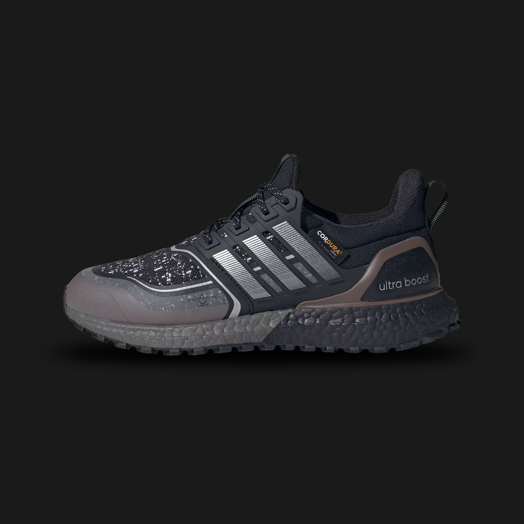 Adidas Ultraboost 1.0 ATR shoes in Core Black, Silver Metallic, and Earth Strata (JP7794). Features the iconic 1.0 Primeknit pattern with a water-repellent All-Terrain finish. Includes a full-length Boost midsole for energy return and a rugged Continental™ WinterGrip rubber outsole for traction on wet surfaces. Luxuntique offers 100% authentic Adidas in Sri Lanka.