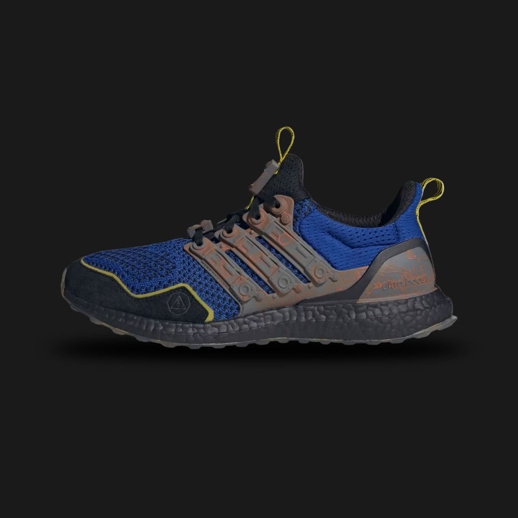 adidas Ultraboost 1.0 Fortnite shoes in Royal Blue, Iron Metallic, and Core Black (Design Code: JQ0713). Featuring the fan-favorite 1.0 Primeknit pattern for breathability, a full-length white Boost midsole for energy return, and exclusive Fortnite branding on the tongue. Finished with Iron Metallic accents on the signature cage. Luxuntique offers 100% authentic adidas Ultraboost collaborations at the lowest price in Sri Lanka.