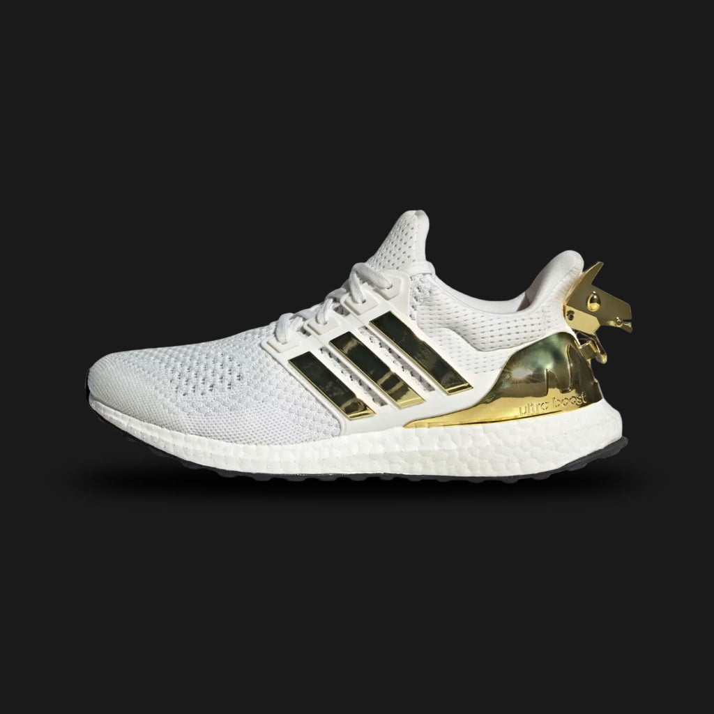 adidas Ultraboost 1.0 Fortnite shoes in Core White, Gold Metallic, and Core Black (Design Code: JQ0717). Featuring the original 1.0 Primeknit pattern, responsive Boost cushioning, and exclusive Fortnite branding on the tongue and insole. Finished with Gold Metallic accents for a premium look. Luxuntique offers 100% authentic adidas Ultraboost collaborations at the lowest price in Sri Lanka.