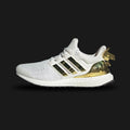 adidas Ultraboost 1.0 Fortnite shoes in Core White, Gold Metallic, and Core Black (Design Code: JQ0717). Featuring the original 1.0 Primeknit pattern, responsive Boost cushioning, and exclusive Fortnite branding on the tongue and insole. Finished with Gold Metallic accents for a premium look. Luxuntique offers 100% authentic adidas Ultraboost collaborations at the lowest price in Sri Lanka.