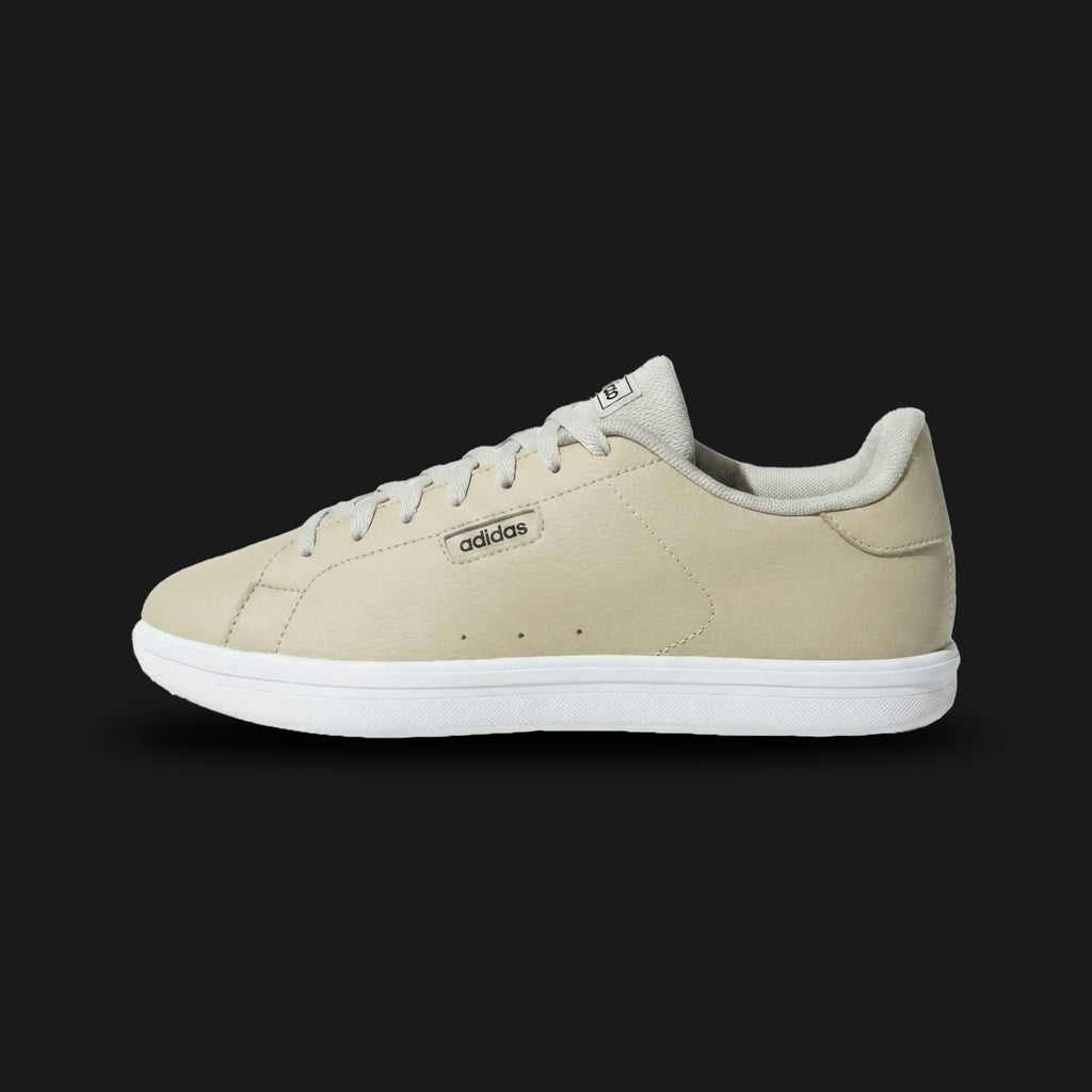 adidas Urban Court IKD tennis shoes in Putty Grey, Core Black, and Cloud White (Design Code: JK1827). Featuring a smooth synthetic leather upper in a premium Putty Grey (greige) tone with bold contrasting Core Black three-stripes and a crisp Cloud White heel tab. Built on a durable rubber cupsole for a classic tennis look with modern urban comfort. Luxuntique offers 100% authentic adidas lifestyle sneakers at the lowest price in Sri Lanka.