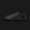 adidas x Entire Studios Ace shoes in Core Black (KI5701). Features a premium monochromatic leather and synthetic upper with a sculpted, minimalist design. Includes layered 3-stripes, an extended heel tab, a luxurious leather sockliner, and a tough rubber outsole with a lasered collaboration logo. Luxuntique offers 100% authentic adidas in Sri Lanka.