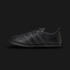 adidas x Entire Studios Ace shoes in Core Black (KI5701). Features a premium monochromatic leather and synthetic upper with a sculpted, minimalist design. Includes layered 3-stripes, an extended heel tab, a luxurious leather sockliner, and a tough rubber outsole with a lasered collaboration logo. Luxuntique offers 100% authentic adidas in Sri Lanka.