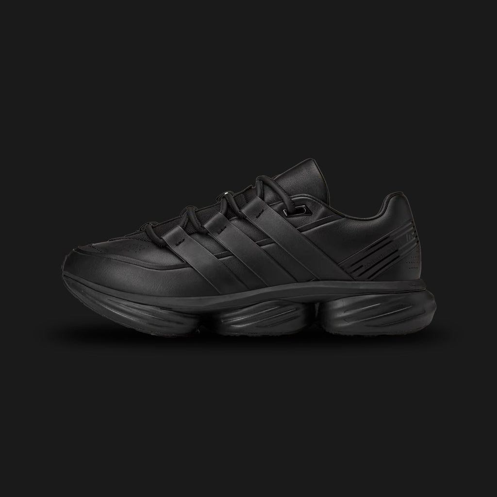 adidas x Entire Studios Lightblaze POD shoes in Core Black (KI3210). Features a monochromatic Triple Black post-apocalyptic design with a premium suede and textile upper, accented by harness-like three stripes. Includes a lightweight Lightstrike cushioning midsole for energy return and a highly durable Adiwear rubber outsole. Luxuntique offers 100% authentic adidas in Sri Lanka.