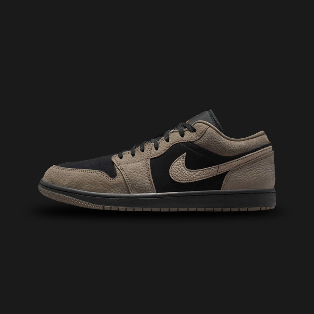 Air Jordan 1 Low SE shoes in Black, Light Wild Mango, and Olive Grey (IB7109-005). Features a premium Black leather base contrasted by earthy Olive Grey suede overlays. Accented by vibrant Light Wild Mango details on the branding and classic low-top profile. Includes an encapsulated Nike Air cushioning unit and durable rubber outsole. Luxuntique guarantees 100% authentic Jordan Brand footwear in Sri Lanka.