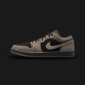 Air Jordan 1 Low SE shoes in Black, Light Wild Mango, and Olive Grey (IB7109-005). Features a premium Black leather base contrasted by earthy Olive Grey suede overlays. Accented by vibrant Light Wild Mango details on the branding and classic low-top profile. Includes an encapsulated Nike Air cushioning unit and durable rubber outsole. Luxuntique guarantees 100% authentic Jordan Brand footwear in Sri Lanka.