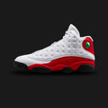 Air Jordan 13 Retro Chicago in White, True Red, and Black (414571-102). Features a premium white tumbled leather upper with signature quilted side panels and rich True Red suede overlays. Includes the iconic holographic panther eye emblem, a Zoom Air cushioned midsole, and a black panther paw-inspired rubber outsole. Luxuntique guarantees 100% authentic Jordan Brand footwear in Sri Lanka.