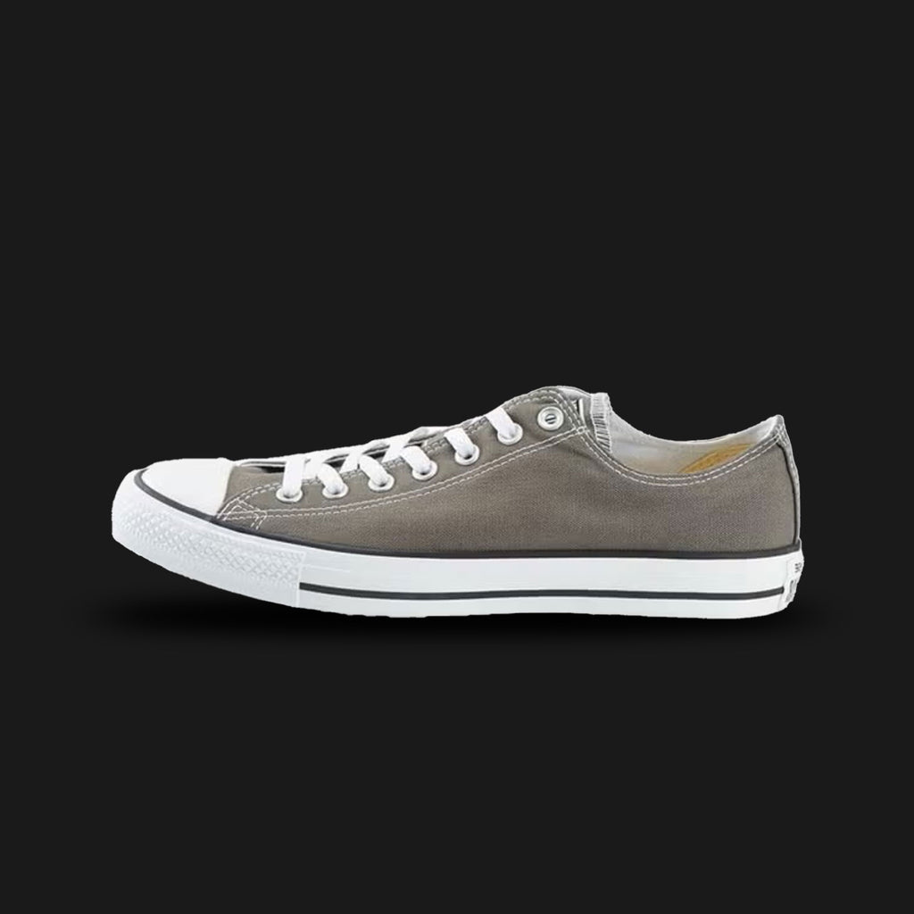 Converse Chuck Taylor All Star High Top shoes in Charcoal (1J794C). Features a durable Charcoal grey canvas upper with classic contrasting white stitching, silver metal eyelets, and the iconic medial Star-centered ankle patch. Finished with a white rubber toe cap, black foxing tape stripes, and a vulcanized diamond-pattern rubber outsole. Luxuntique offers 100% authentic Converse in Sri Lanka.