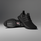 Black Adidas ULTRABOOST 1.0 sneakers on a gray background