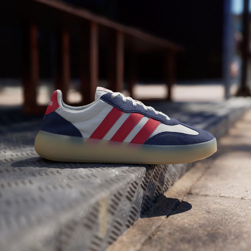 Adidas Barreda Decode JP9667 - Front 3/4 Pair Shot on Metal Grating in Off White/Pure Ruby/Dark Blue showing Premium Leather & Suede Upper, Bold Ruby Three Stripes, Dark Blue Overlays & Gum Midsole