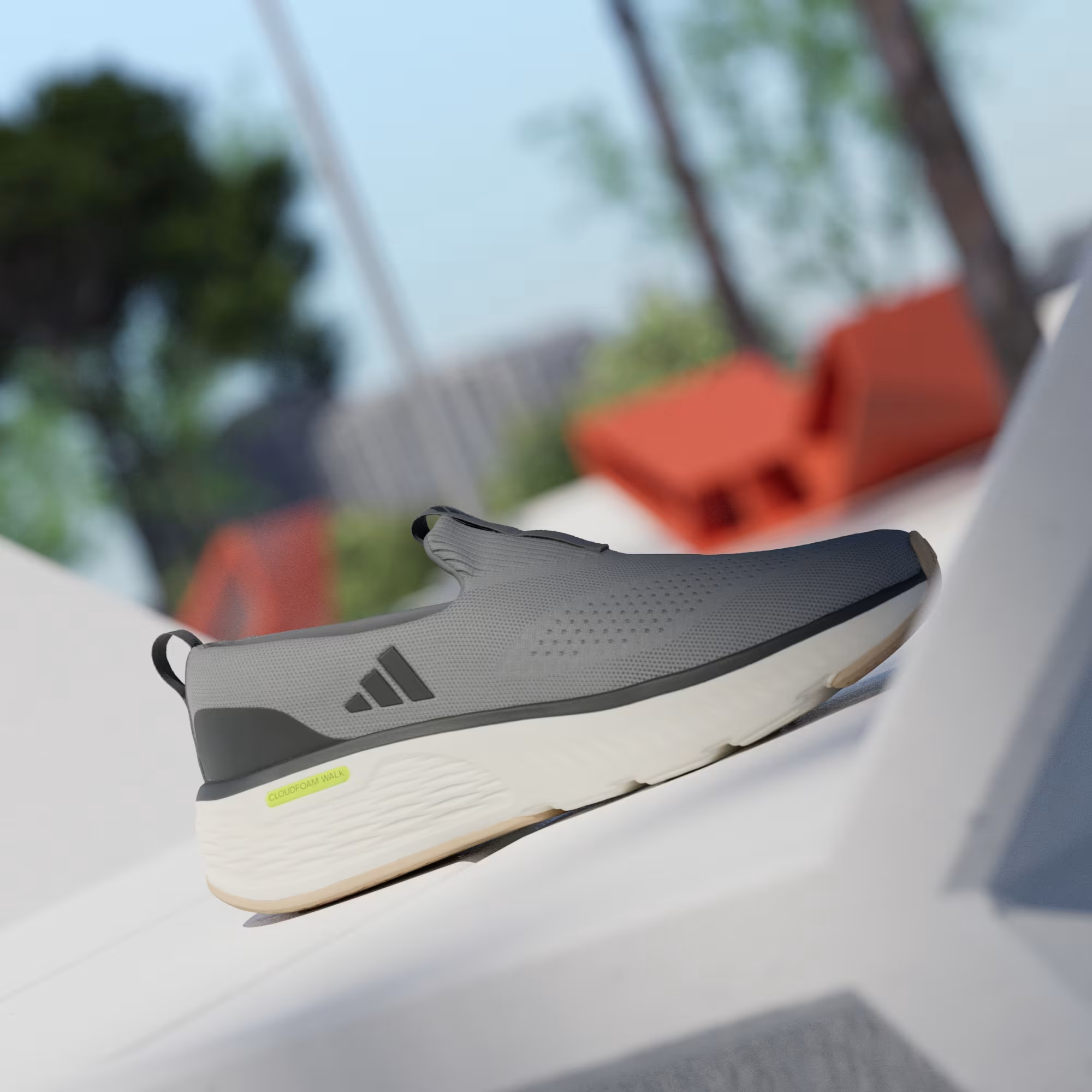 Adidas Cloudfoam Go Lounger ID4021 - Lateral Profile on White Ledge in Grey Three/Core Black showing Knit Mesh Upper, Dark Grey Three Stripes, Black Toe Cap, Neon Yellow Cloudfoam Walk Branding & Chunky Off White Midsole