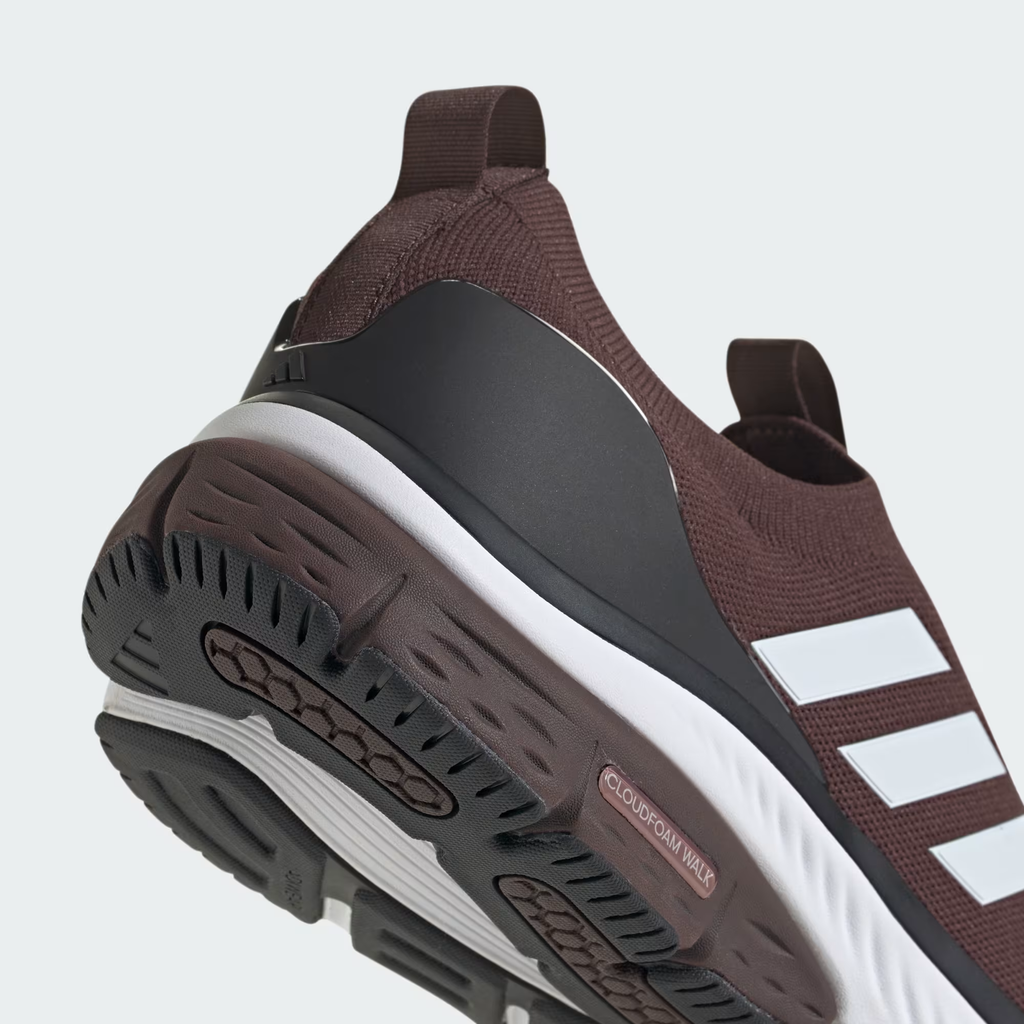 Adidas Cloudfoam Walk Sock ID4063 - Forefoot & Three Stripes Close-up showing Shadow Brown Engineered Knit Dot-Ventilation Pattern on Toe Box, Front Elastic Band Pull Tab, Cloud White Three Stripes Overlay on Lateral Midfoot, Cloud White Cloudfoam Walk Midsole Sidewall & Black Rubber Outsole Edge