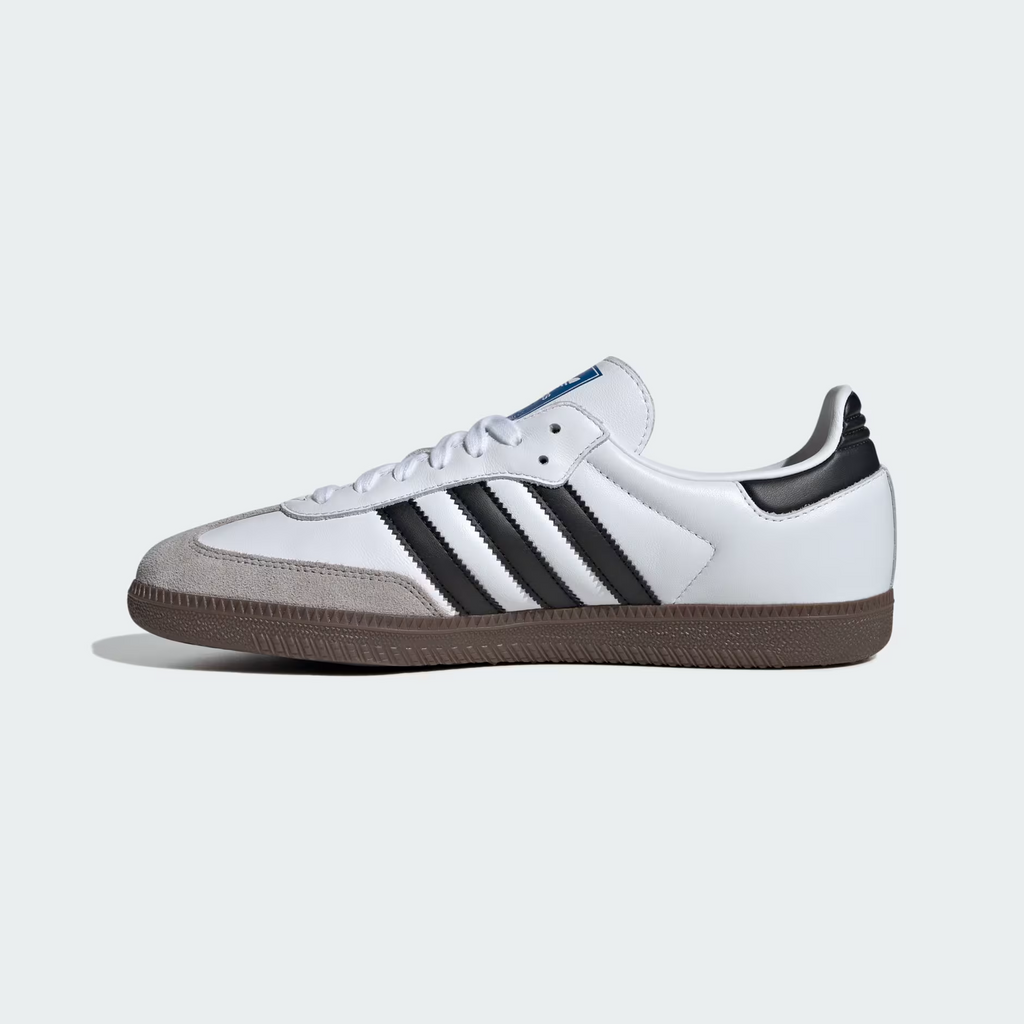 Adidas Samba OG B75806 - Toe Box & Forefoot Close-up showing Clear Granite Suede Toe Cap Texture, Cloud White Full-Grain Leather Upper, White Flat Laces, Core Black Three Stripes Base & Blue Adidas Originals Tongue Label