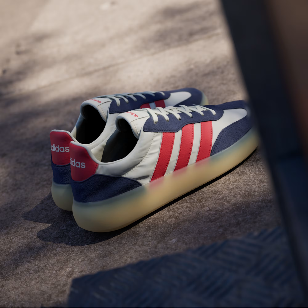 Adidas Barreda Decode JP9667 - Low-Angle Front 3/4 Pair Shot on Street in Off White/Pure Ruby/Dark Blue showing Ruby Three Stripes, Dark Blue Suede Toe Box & Chunky Translucent Gum Midsole
