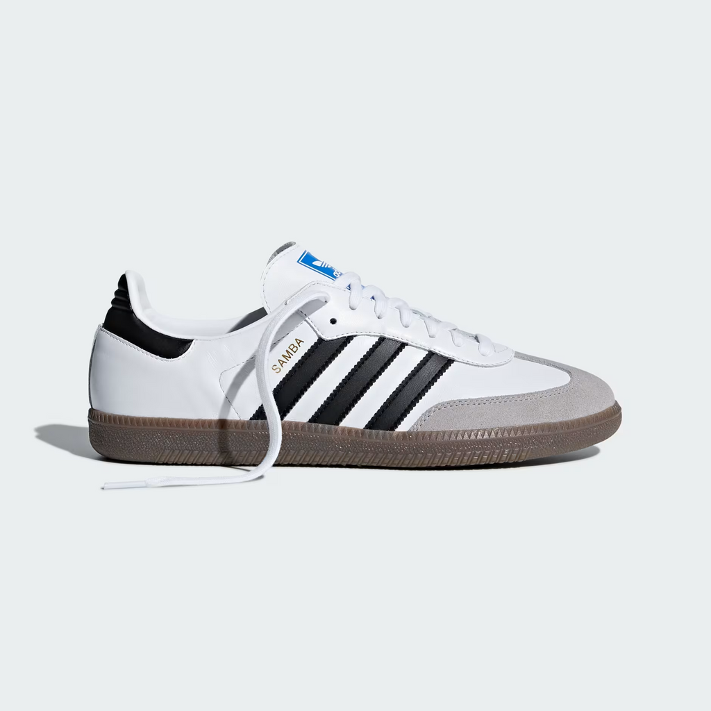 Adidas Samba OG B75806 - Outsole Close-up showing Full Gum Rubber Outsole with Pyramid Traction Pattern, Circular Pivot Points, Core Black Three Stripes on Midsole Edge & Clear Granite Suede Toe Box Edge