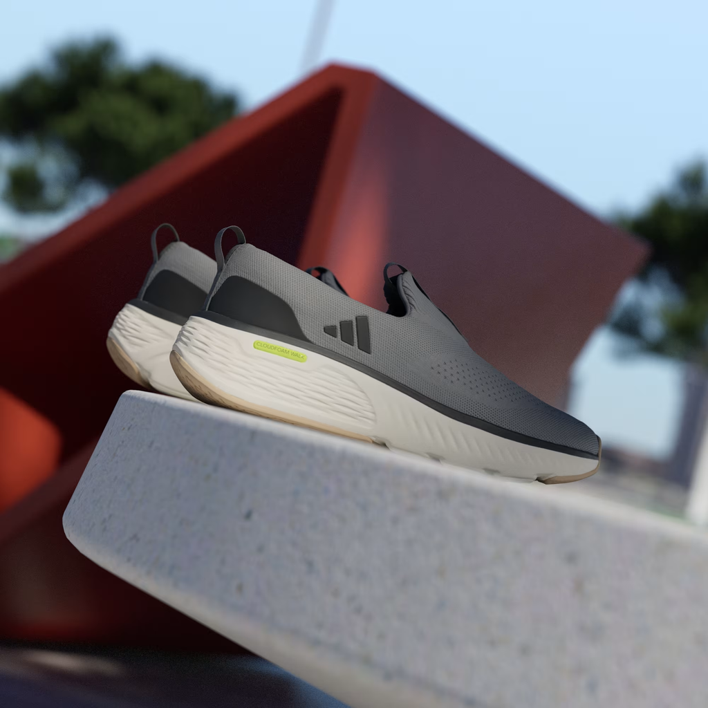 Adidas Cloudfoam Go Lounger ID4021 - Rear 3/4 Pair Shot on White Ledge with Red Background showing Grey Three Knit Upper, Dark Grey Three Stripes, Neon Yellow Cloudfoam Walk Midsole Branding & Off White Chunky Midsole