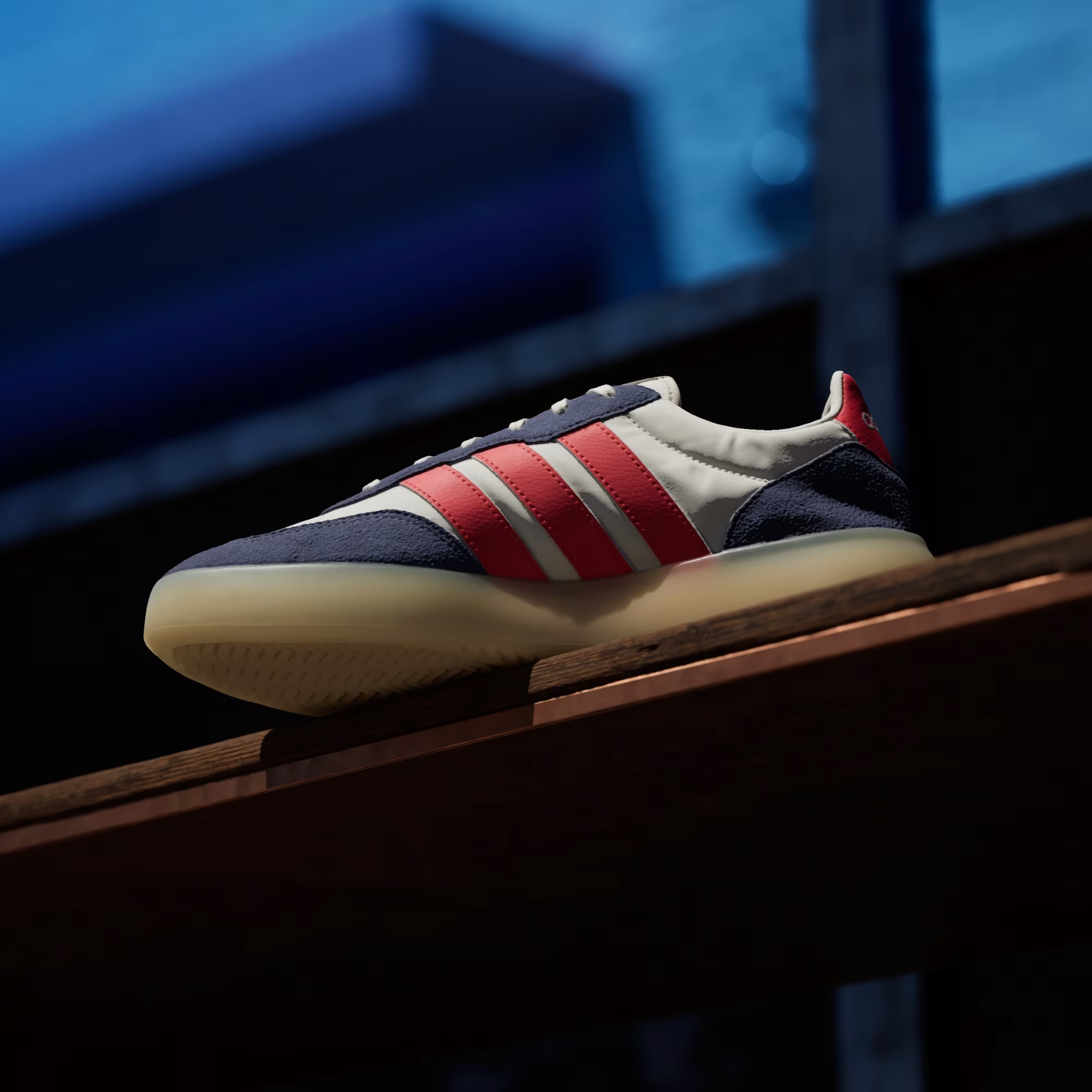 Adidas Barreda Decode JP9667 - Rear Heel Close-up on Street showing Pure Ruby Heel Tab with Adidas Script, Dark Blue Suede Heel Counter, Off White Leather Upper & Gum Midsole