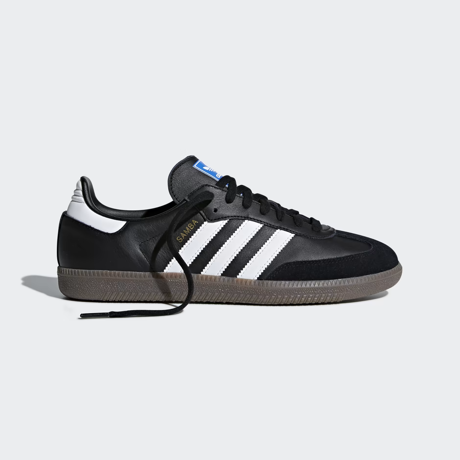 Adidas Samba OG B75807 - Full Gum Rubber Outsole Close-up showing Triangular Traction Pattern, Circular Pivot Point at Heel, Dome Pivot Points at Forefoot & Gum Brown Translucent Rubber Compound