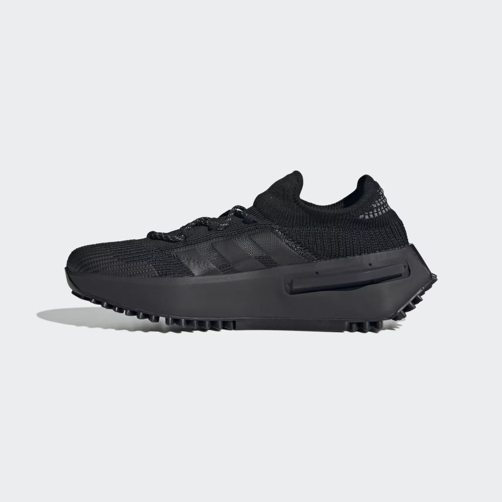 Adidas NMD_S1 FZ6381 - Outsole Close-up on White Background showing Black Rubber Traction Pattern with Trefoil Logo Pods, Circular Perforations & Lug Perimeter Grip