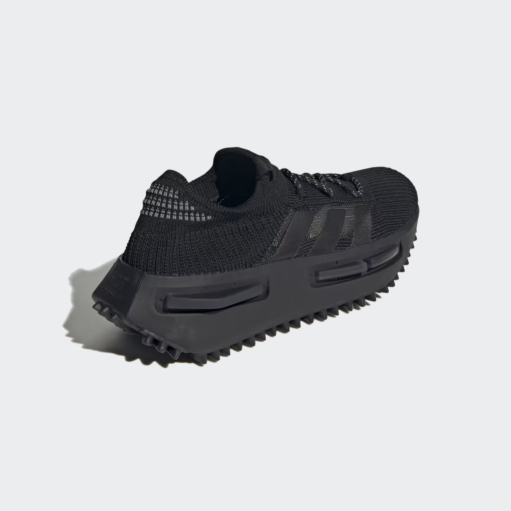 Adidas NMD_S1 FZ6381 - Pair Shot on White Background showing Both Lateral and Medial Profiles in Core Black Primeknit, Tonal Black Three Stripes, Black Boost Midsole with NMD Plugs & Chunky Black Lug Outsole