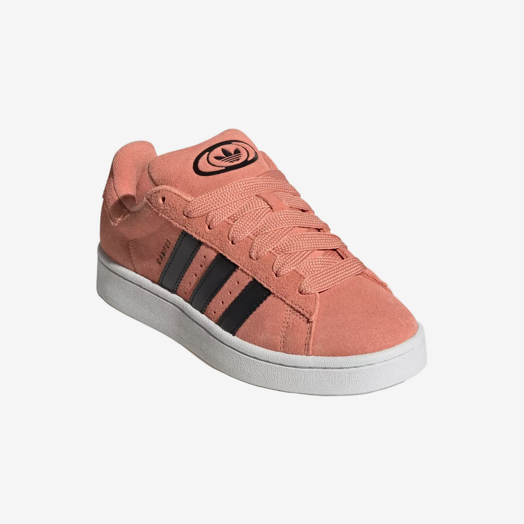 Pink Adidas sneaker with black stripes on a light gray background