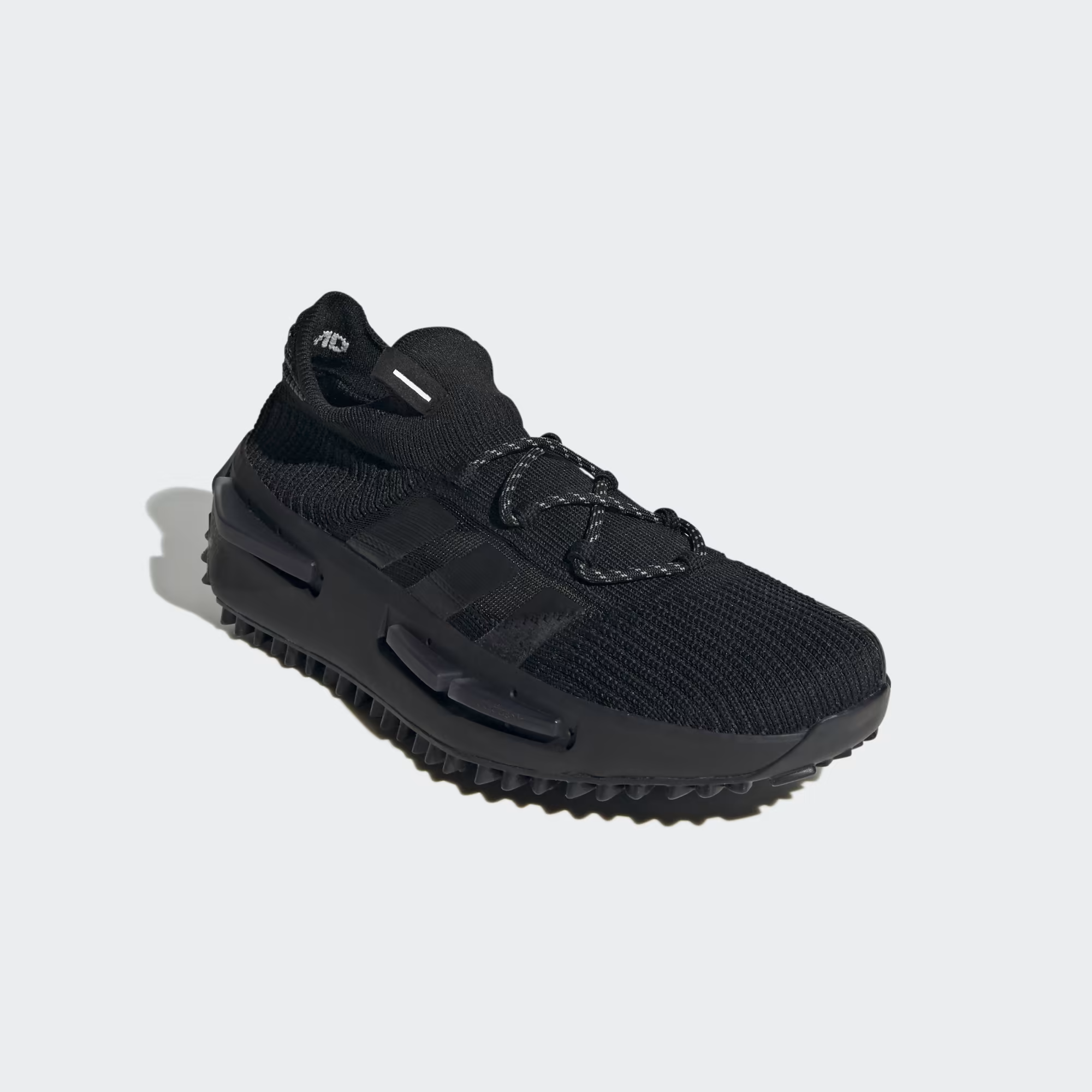 Adidas NMD_S1 FZ6381 - Clean Lateral Profile on White Background showing Full Core Black Primeknit Silhouette, Tonal Black Three Stripes, Black Boost Midsole with NMD Plug Detail & Chunky Black Lug Rubber Outsole