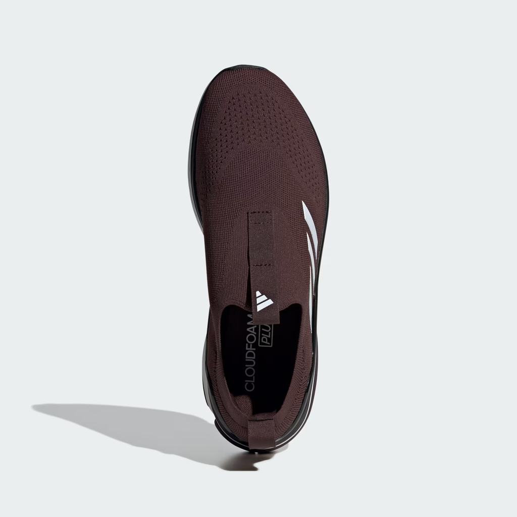 Adidas Cloudfoam Walk Sock ID4063 - Full Rubber Outsole Top-Down on Light Grey Background in Black/Shadow Brown showing Segmented Multi-Zone Traction Pads with Honeycomb Texture, X-shaped Flex Groove Channels, Shadow Brown Heel Traction Pad & Cloudfoam Walk Embossed on Heel