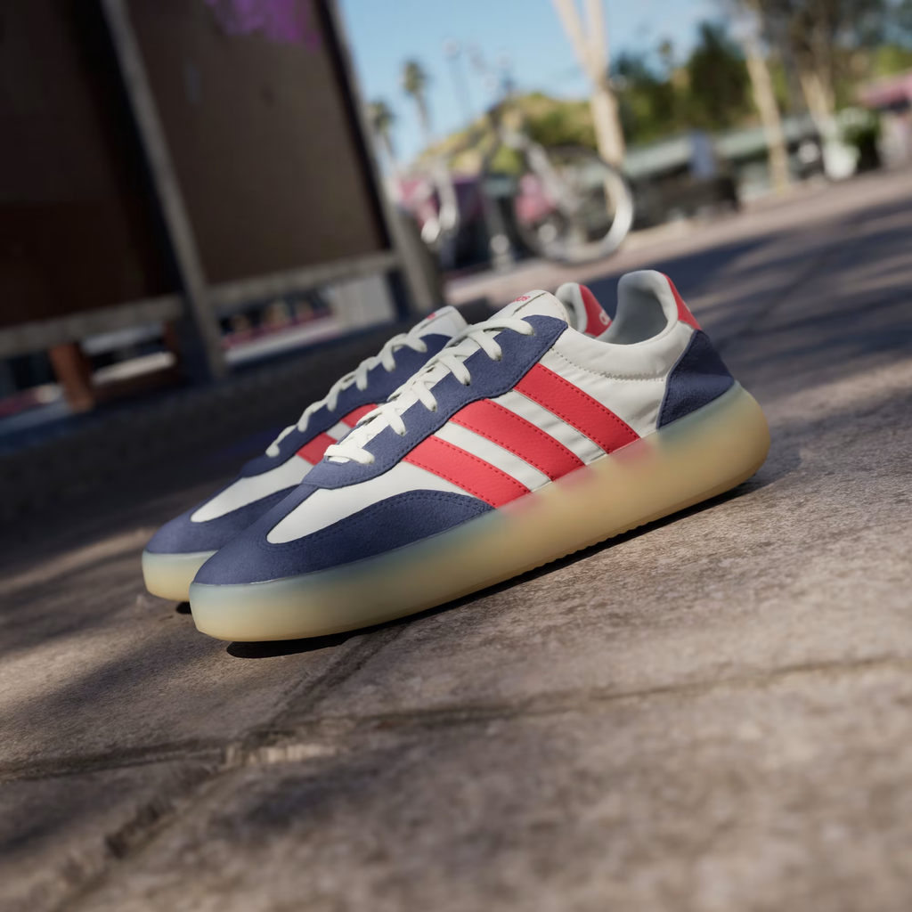 Adidas Barreda Decode JP9667 - Lateral Forefoot Close-up on Street showing Off White Leather Upper, Bold Pure Ruby Three Stripes, Dark Blue Suede Toe Overlay & Translucent Gum Midsole