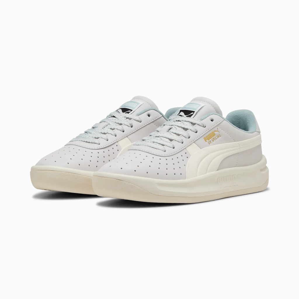 Puma GV Special 401385_01 - Front 3/4 Pair Shot in PUMA White/Warm White showing Perforated Leather Upper, White Formstrip, Gold GV Special Branding & Ice Blue Collar