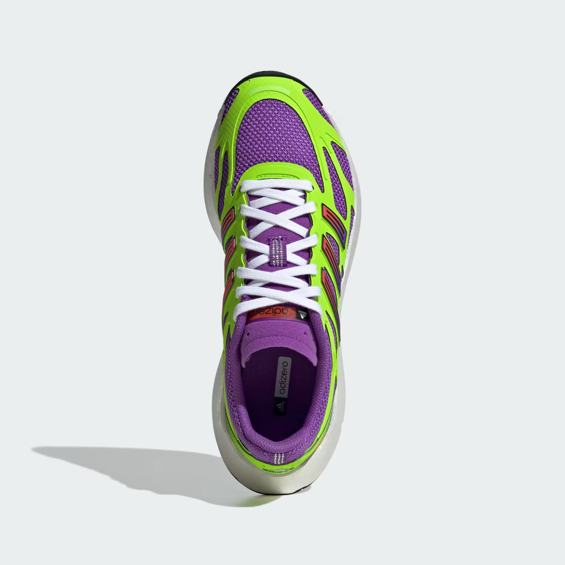 Adidas Adizero Aruku JP5566 - Rear 3/4 Shot on White Background showing Active Purple Mesh Upper, Solar Green Exoskeleton Frame, Adizero Branding on Heel, Purple Padded Collar & Chunky White Swirl-Foam Midsole with Black Outsole