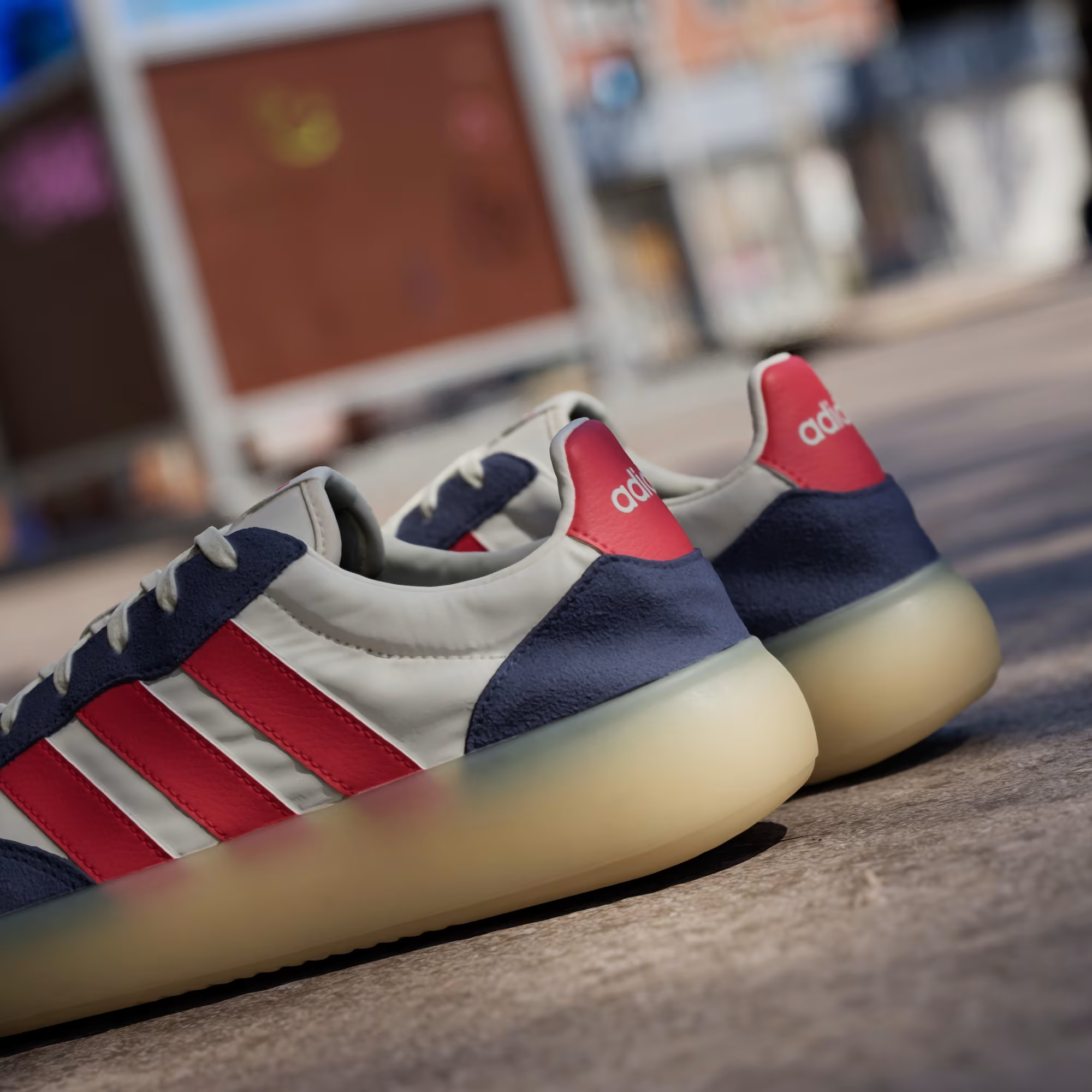 Adidas Barreda Decode JP9667 - Outsole & Midsole Close-up showing Translucent Gum Rubber Outsole with Traction Pattern, Dark Blue Suede Toe Box & Pure Ruby Three Stripes