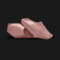Jordan Hex Mule in Red Stardust (DX6405-600). Features a geometric, hexagonal bio-foam construction in a solid monochrome dusty rose Red Stardust finish. Minimalist design with a squared toe, grooved footbed, and subtle Jumpman branding. Durable traction outsole. Luxuntique offers 100% authentic Jordan slides in Sri Lanka.