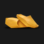 Jordan Hex Mule in Yellow Ochre (DX6405-700). Features a geometric, hexagonal bio-foam construction in a solid monochrome Yellow Ochre finish. Minimalist design with a squared toe, grooved footbed for comfort, and subtle Jumpman branding. Durable traction outsole. Luxuntique offers 100% authentic Jordan slides in Sri Lanka.