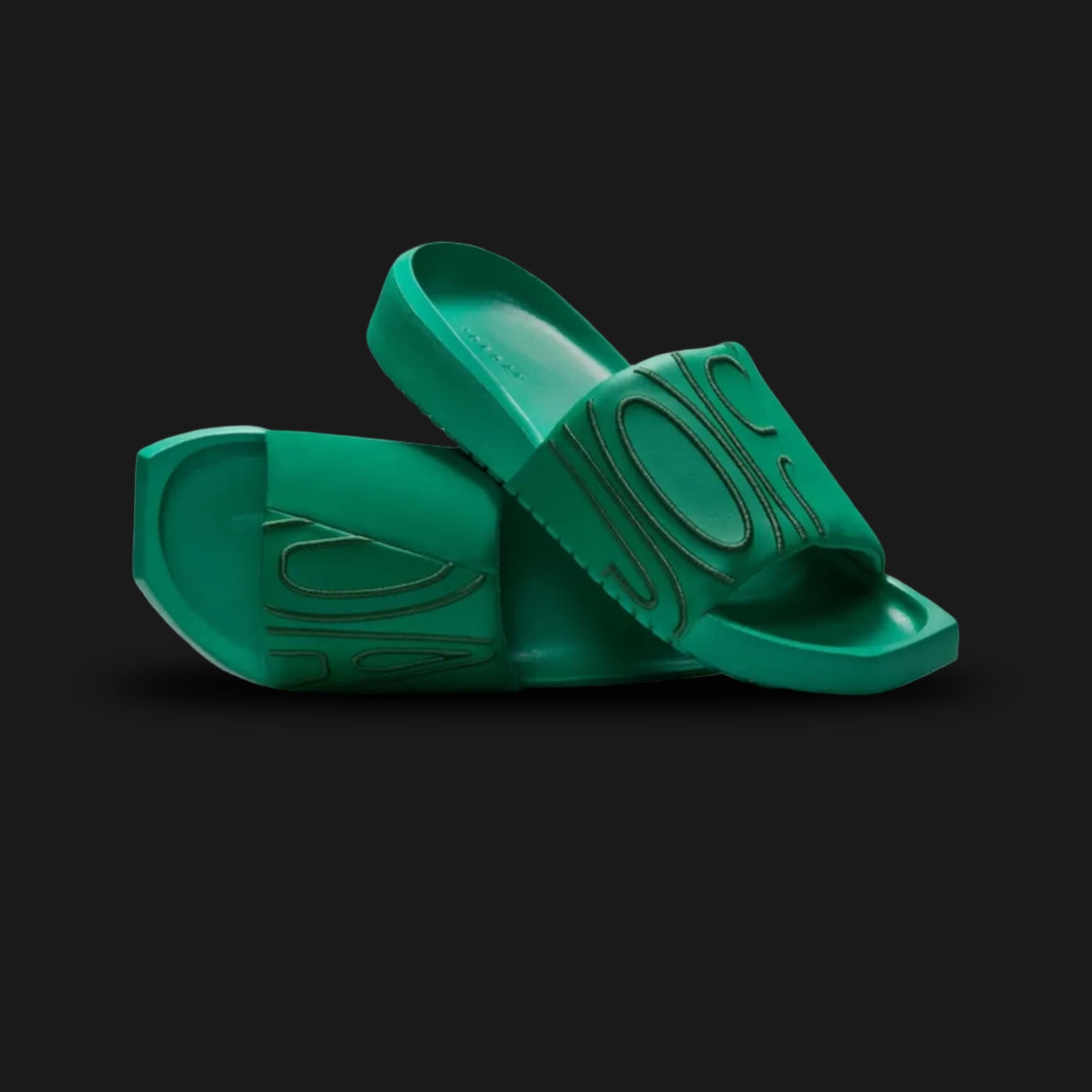 Jordan NOLA slides in Malachite and Fir green (CZ8027-301). Features a premium wide strap with Jordan branding, a modern squared-off toe design, and a comfortable molded foam footbed in a deep jewel-toned green finish. Luxuntique offers 100% authentic Jordan slides in Sri Lanka.