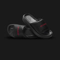 Jordan Sophia women's slides in Black and Gym Red (DO8863-001). Featuring a premium criss-cross padded strap with soft lining and a Gym Red Jumpman logo. Elevated platform foam midsole with Air cushioning and a durable rubber outsole. Luxuntique offers 100% authentic Jordan slides in Sri Lanka.