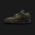 Jordan Spizike Low lifestyle sneakers in Medium Olive, Black, Baroque Brown, and University Red (Design Code: IH1782-200). Featuring a rugged Medium Olive upper combined with iconic black elephant print mudguard overlays at the toe and heel. Accented with midfoot netting, dark Baroque Brown details, and vibrant University Red branding, all supported by a durable black midsole with a visible Air-Sole unit. Luxuntique offers 100% authentic Air Jordan hybrid footwear at the lowest price in Sri Lanka.