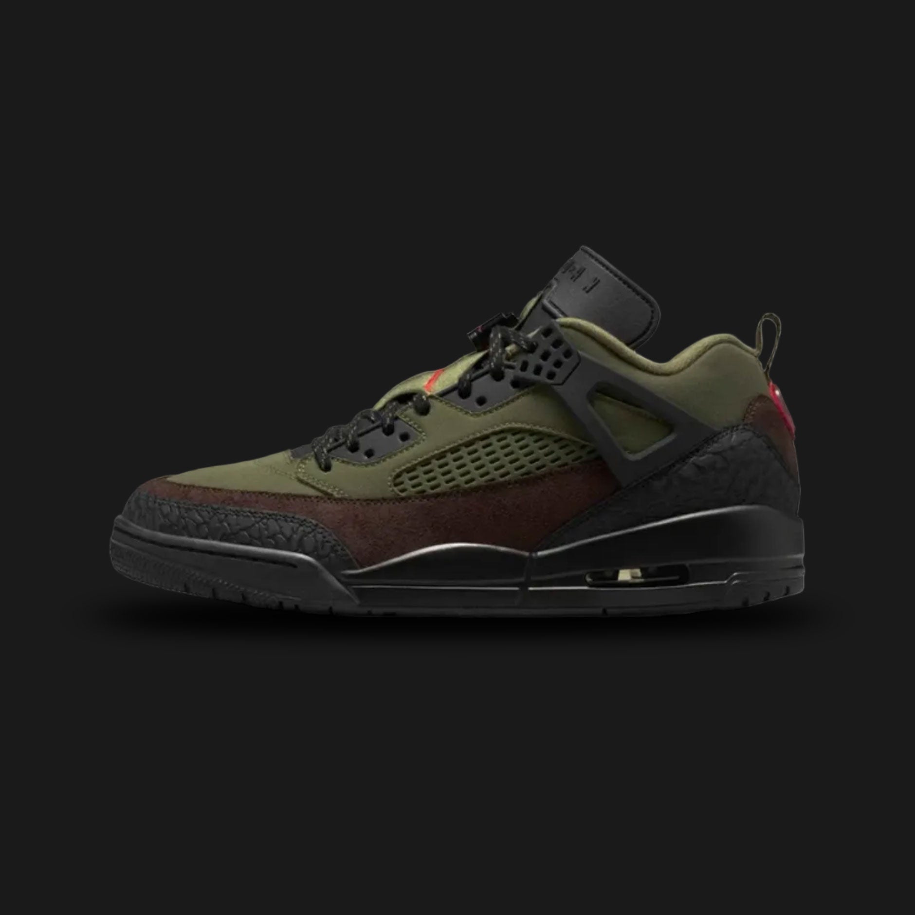 Jordan Spizike Low lifestyle sneakers in Medium Olive, Black, Baroque Brown, and University Red (Design Code: IH1782-200). Featuring a rugged Medium Olive upper combined with iconic black elephant print mudguard overlays at the toe and heel. Accented with midfoot netting, dark Baroque Brown details, and vibrant University Red branding, all supported by a durable black midsole with a visible Air-Sole unit. Luxuntique offers 100% authentic Air Jordan hybrid footwear at the lowest price in Sri Lanka.