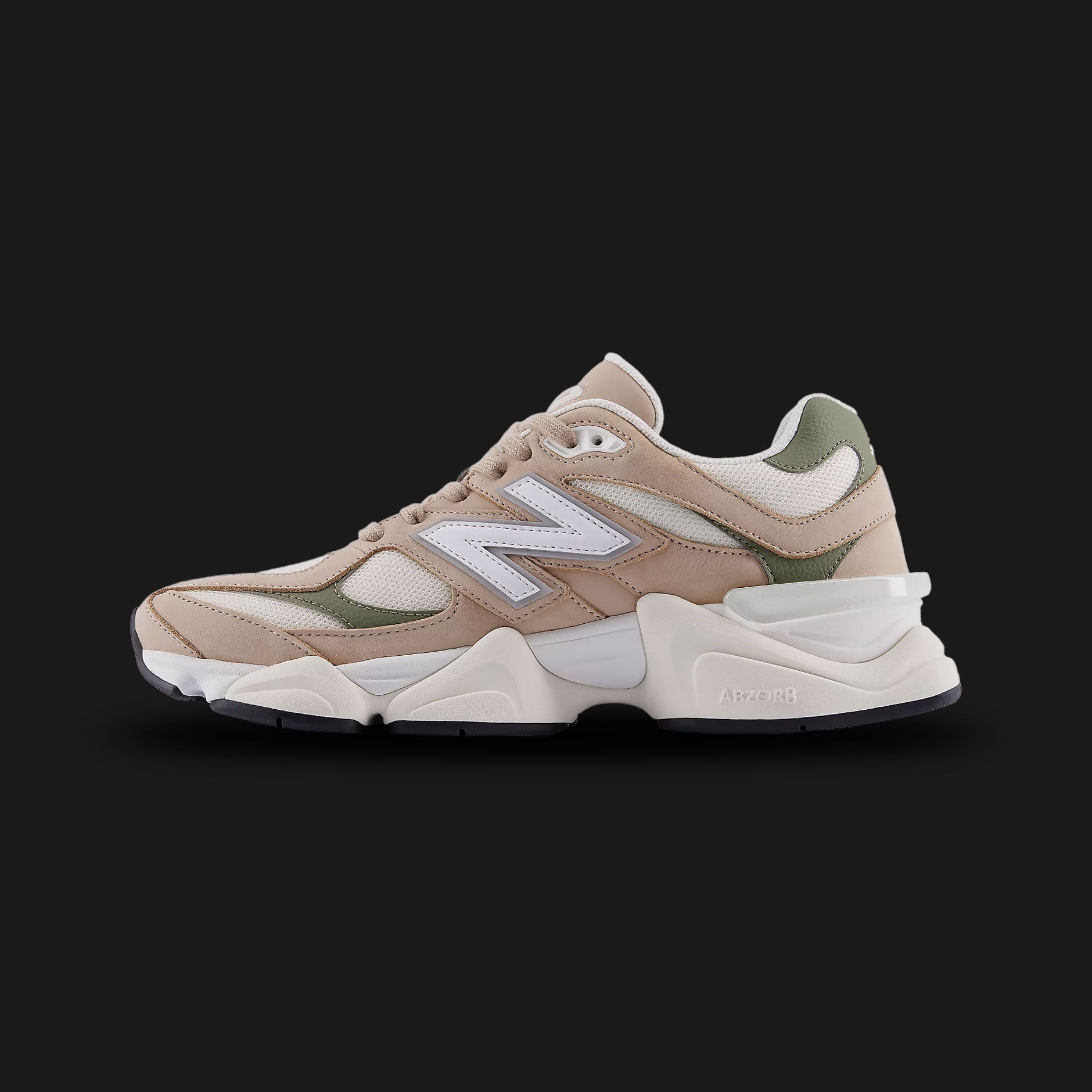 New Balance 9060 sneakers in Mindful Grey with Dark Olivine (U90606BI). Features a futuristic, chunky silhouette reimagined from classic 99X models, showcasing a premium pigskin suede and breathable mesh upper in neutral Mindful Grey with sophisticated Dark Olivine green accents. Equipped with a sculpted dual-density ABZORB and SBS cushioned midsole, a translucent heel clip, and a unique diamond outsole pattern for everyday lifestyle comfort and bold street style. Luxuntique guarantees 100% authentic New Ba