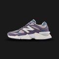 New Balance 9060 sneakers in Neptune Grey with Shadow Blue (U9060528). Features a futuristic, chunky silhouette reimagined from classic 99X models, showcasing a premium suede and breathable mesh upper in cool Neptune Grey with sophisticated Shadow Blue overlays. Equipped with a sculpted dual-density ABZORB and SBS cushioned midsole, a translucent CR heel clip, and a unique diamond outsole pattern for everyday lifestyle comfort and bold street style. Luxuntique guarantees 100% authentic New Balance footwear 