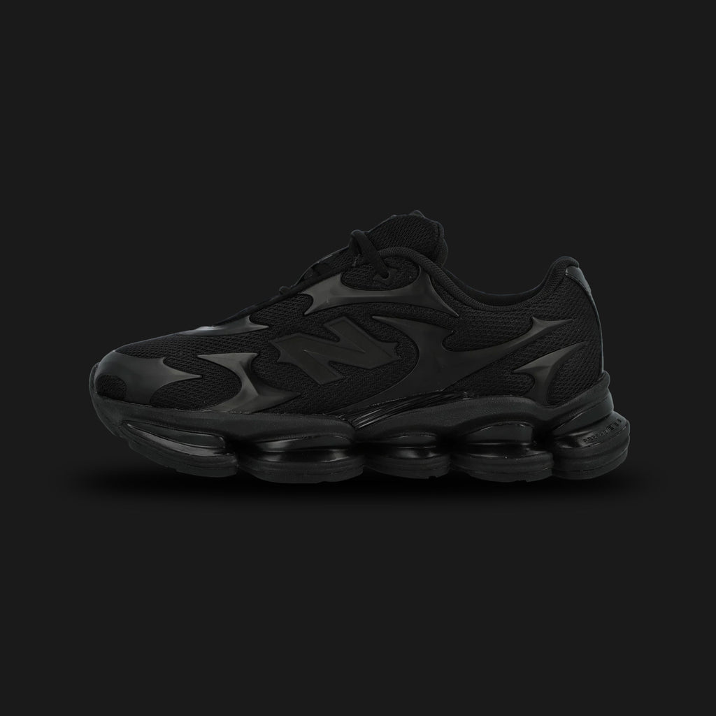 New Balance ABZORB 2000 shoes in Black Metallic (U200078C). Features a minimalist mesh upper with futuristic overlay patterns, a segmented full-length ABZORB sole unit, and ABZORB SBS heel pods for maximum stability. Luxuntique guarantees 100% authentic "New Balance" footwear in Sri Lanka.
