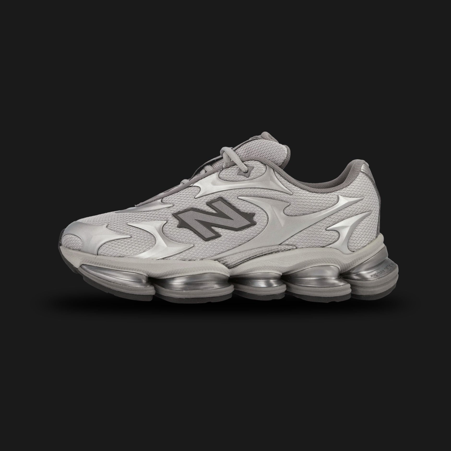 New Balance ABZORB 2000 shoes in Silver Metallic (U20005UW). Features a tech-mesh upper with reflective curvilinear overlays, a segmented full-length ABZORB sole unit, and ABZORB SBS heel pods for maximum stability. Luxuntique guarantees 100% authentic "New Balance" footwear in Sri Lanka.