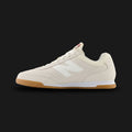New Balance RC42 shoes in Linen and Sea Salt (URC42EA). Features a premium suede and leather upper, low-profile retro 70s wedge silhouette, stitched N logo, and a durable rubber outsole. Luxuntique guarantees 100% authentic footwear.