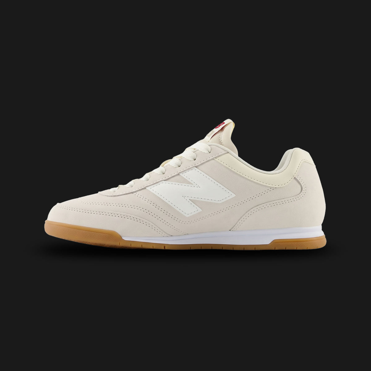 New Balance RC42 shoes in Linen and Sea Salt (URC42EA). Features a premium suede and leather upper, low-profile retro 70s wedge silhouette, stitched N logo, and a durable rubber outsole. Luxuntique guarantees 100% authentic footwear.
